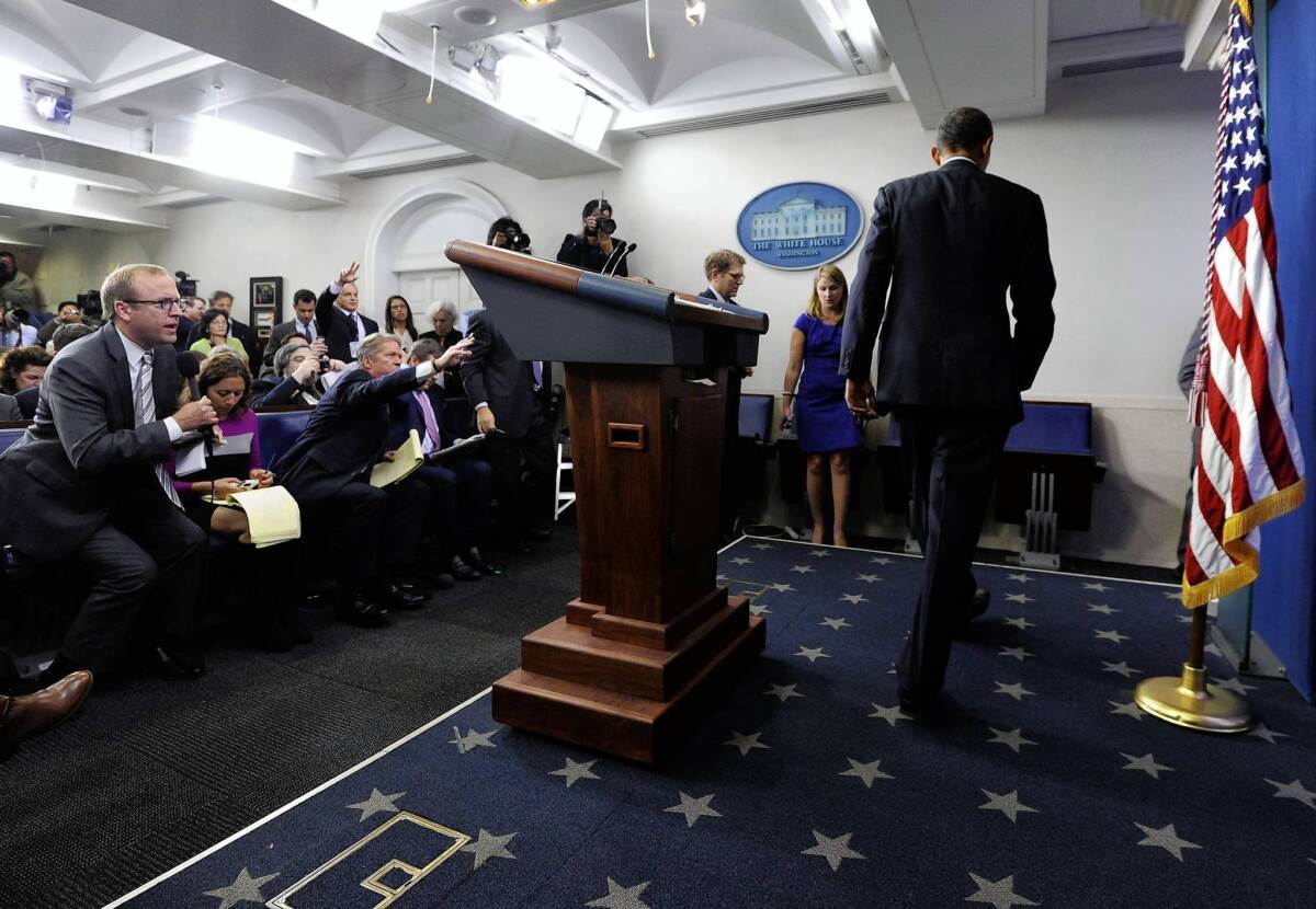 President Obama leaves a White House news conference. He cast himself as a rational player in the budget drama.