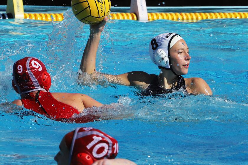 Newport Harbor's Madison Mack (8) looks for an open player during Newport Harbor's girls' water polo team against Mater Dei High School girls' water polo team in the semifinals of the Newport Invite Tournament at Newport Harbor High School, in Newport Beach on Saturday, January 27, 2024. (Photo by James Carbone)