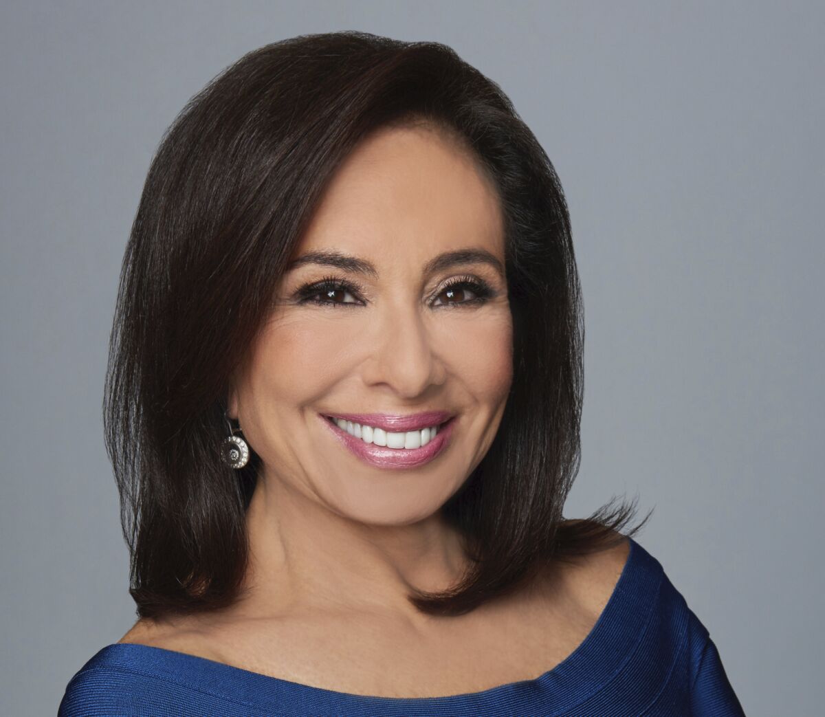 A smiling woman with dark hair.