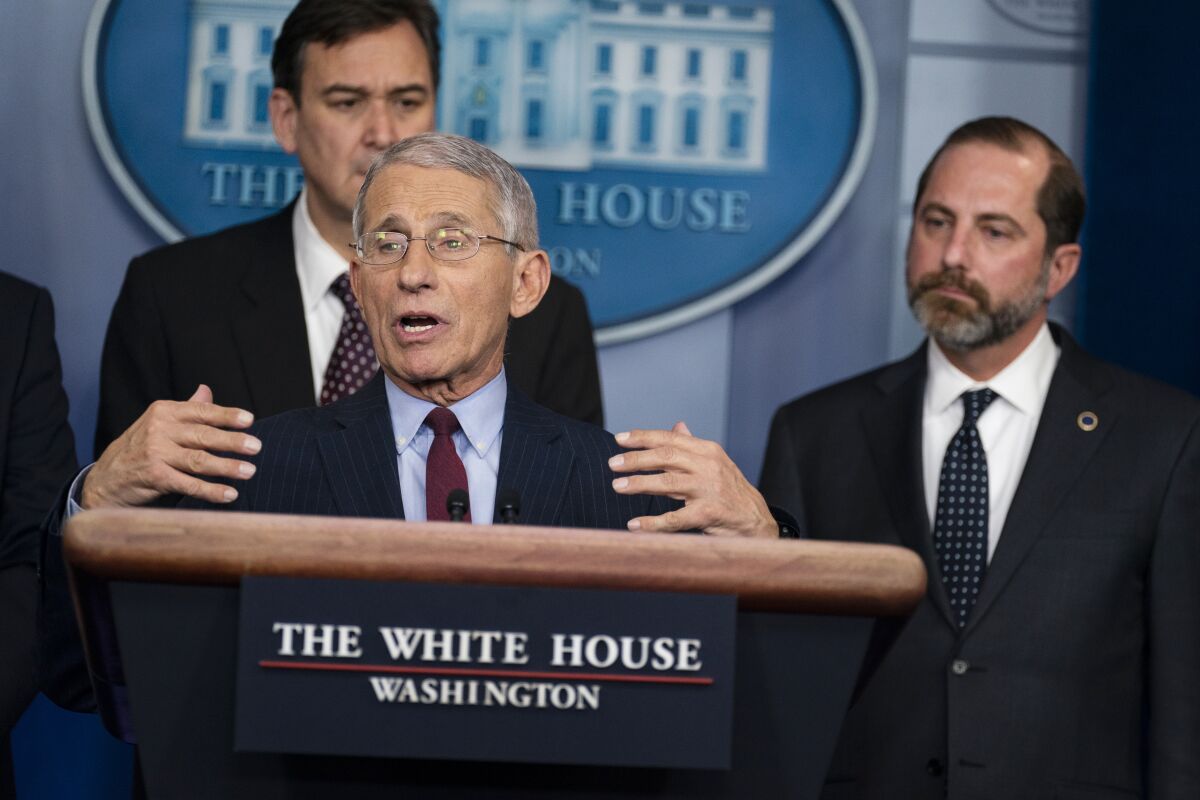 Dr. Anthony Fauci, director of the National Institute of Allergy and Infectious Diseases at the National Institutes of Health, speaks about the coronavirus at the White House on Jan. 31. Behind him are acting Under Secretary of Transportation for Policy at the Department of Transportation Joel Szabat (left) and Secretary of Health and Human Services Alex Azar.