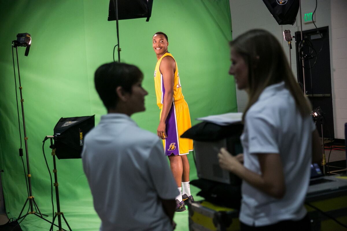 Lakers center Robert Upshaw smiles for the camera at a filming session during the Lakers' media day in El Segundo.