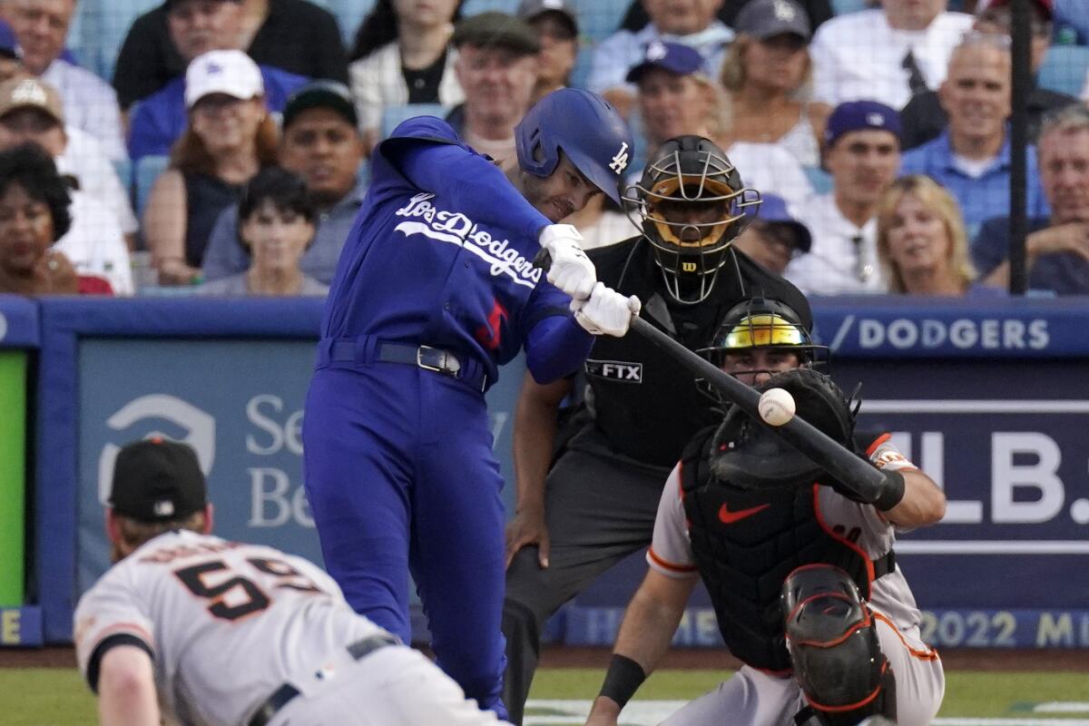 The Dodgers' Freddie Freeman connects for a solo home run off Giants relief pitcher John Brebbia on July 23, 2022.
