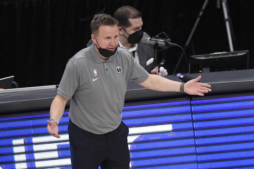 Washington Wizards head coach Scott Brooks gestures during the second half of an NBA basketball game against the Golden State Warriors, Wednesday, April 21, 2021, in Washington. (AP Photo/Nick Wass)