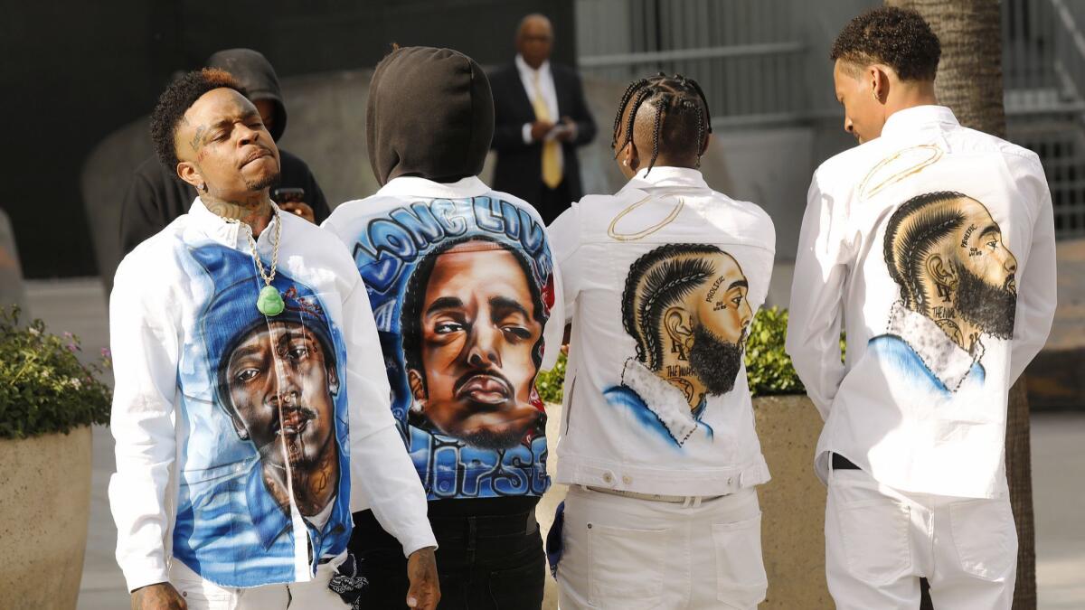 Romero Roberson designed the shirts he and friends wore to the Nipsey Hussle memorial.