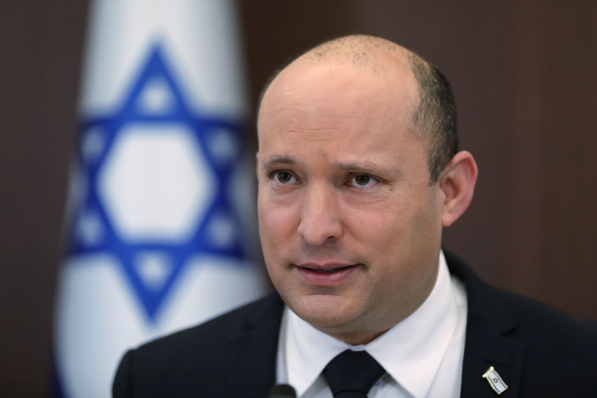 FILE - Israeli Prime Minister Naftali Bennett attends a cabinet meeting at the prime minister's office in Jerusalem, Israel Sunday, Oct. 24, 2021. Israeli lawmakers are set to begin marathon voting on Wednesday, Nov. 3, 2021, to try and pass the first national budget in three years, a major test for the fractious coalition government that was sworn in earlier this year after four divisive elections. (Abir Sultan/Pool Photo via AP, File)