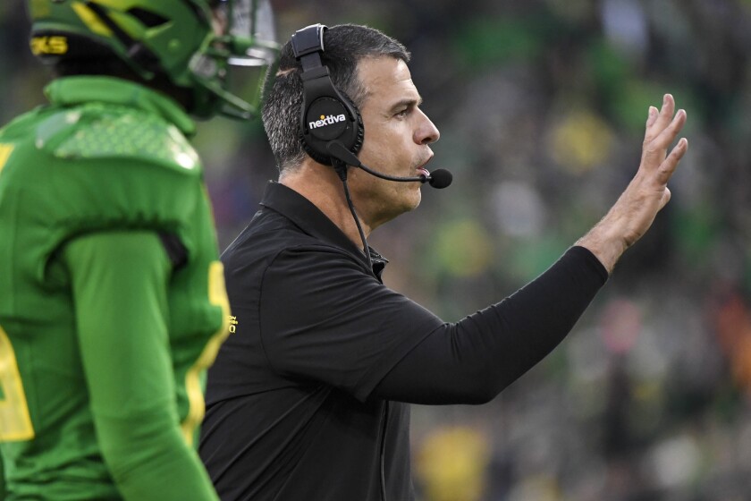 Oregon head coach Mario Cristobal directs his players during the fourth quarter of an NCAA college football game against Oregon State, Saturday, Nov. 27, 2021, in Eugene, Ore. (AP Photo/Andy Nelson)