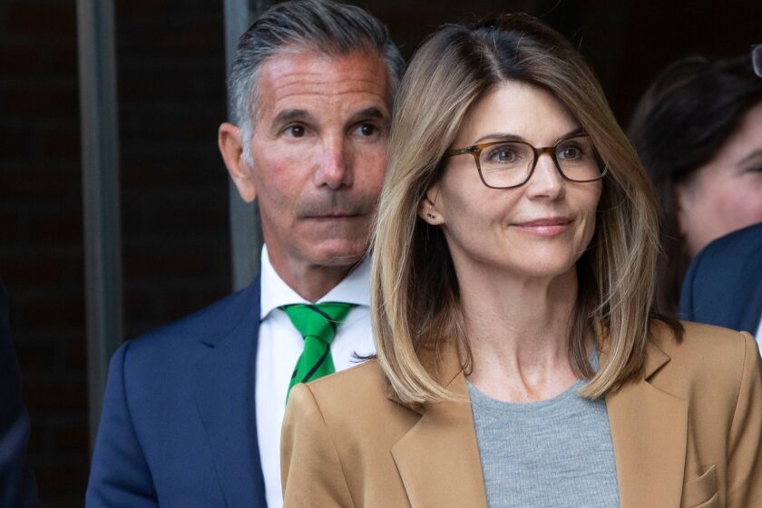Mandatory Credit: Photo by CJ GUNTHER/EPA-EFE/REX (10185949s) US actress Lori Loughlin (R) and husband Mossimo Giannulli (L) leave the John J Moakley Federal Court House after facing charges in a nationwide college admissions cheating scheme in Boston, Massachusetts, USA 03 April 2019. Lori Loughlin facing charges in a nationwide college admissions cheating scheme, Boston, USA - 03 Apr 2019 ** Usable by LA, CT and MoD ONLY **