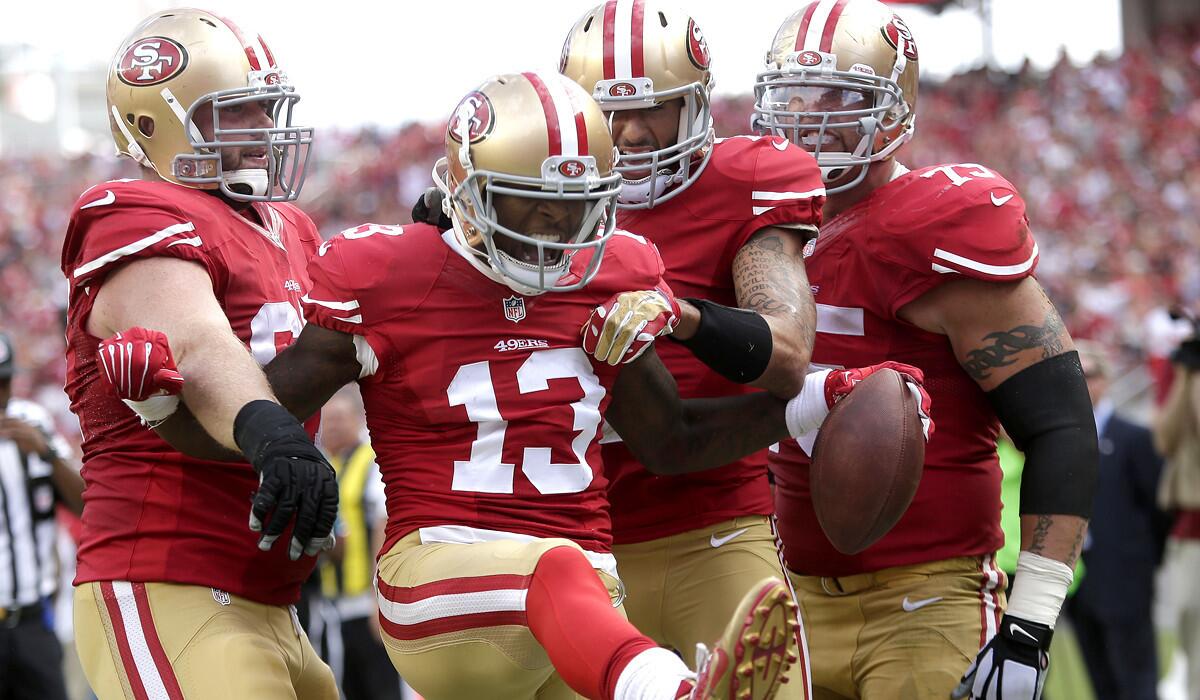 San Francisco 49ers wide receiver Steve Johnson (13) celebrates with teammates after catching a 12-yard touchdown pass against the Philadelphia Eagles in the third quarter Sunday in Santa Clara.