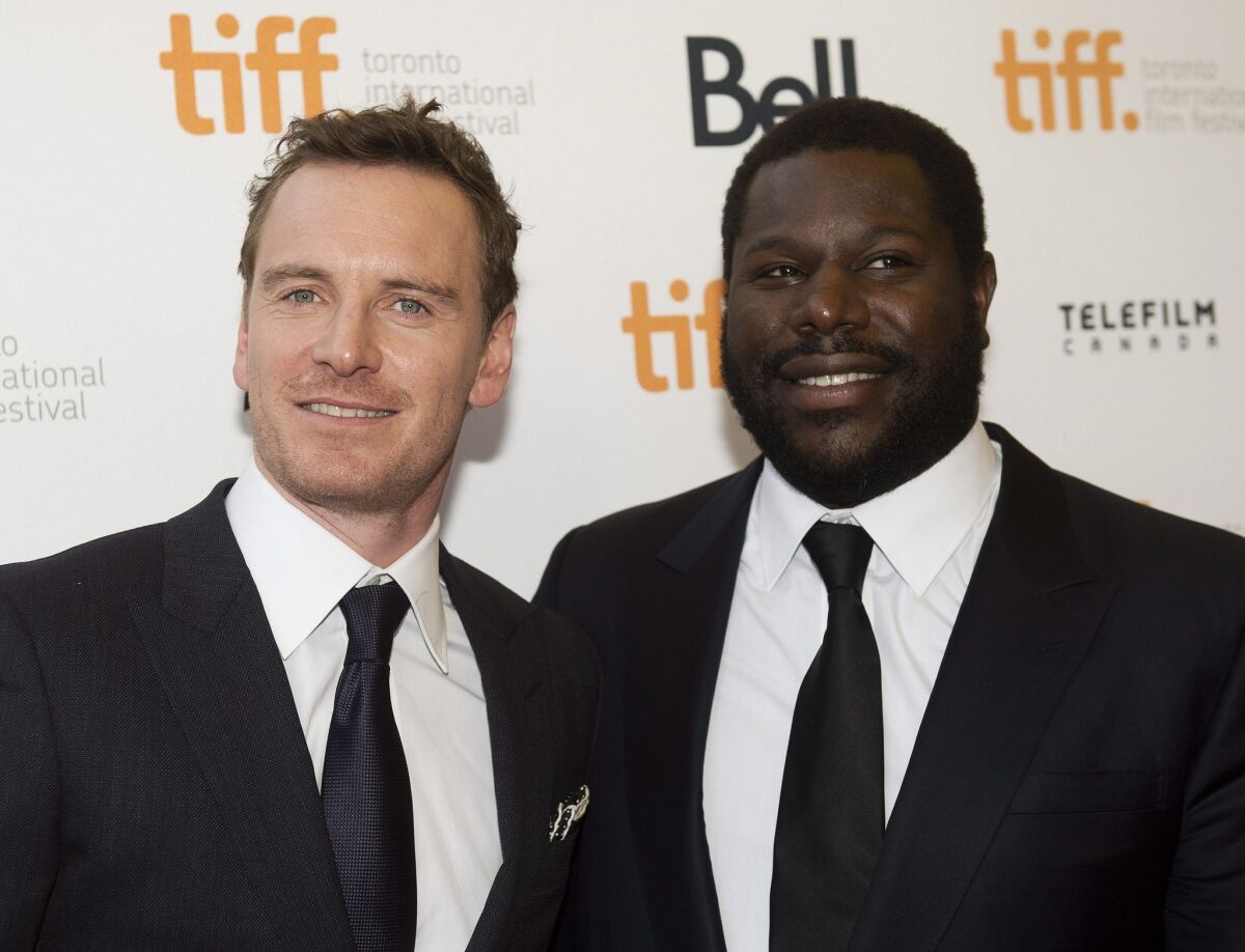 Actor Michael Fassbender, left, and director Steve McQueen on the red carpet at the Toronto International Film Festival.