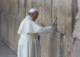 Pope Francis prays in front of the Western Wall