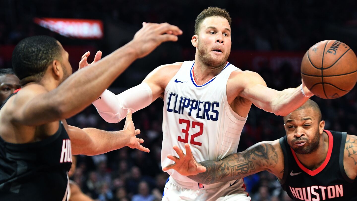 Clippers' Blake Griffin battles for a loose ball with Houston Rockets' P.J. Tucker, right, in the fourth quarter.