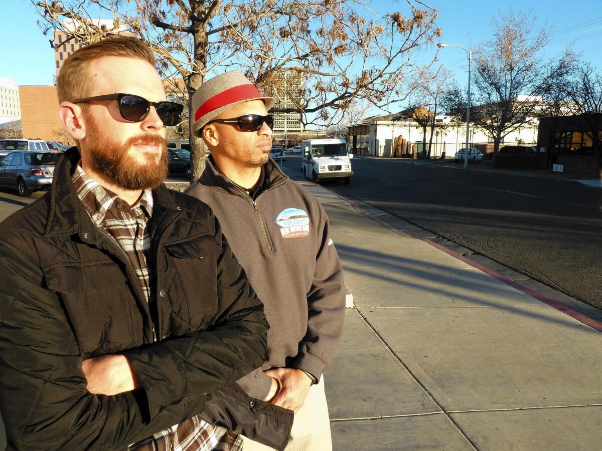 Jesse Herron, left, and Mike Silva run a weekly trolley tour of "Breaking Bad" film sites. "We've never had one person say we're glorifying meth," Silva said. "We're just celebrating a phenomenon."