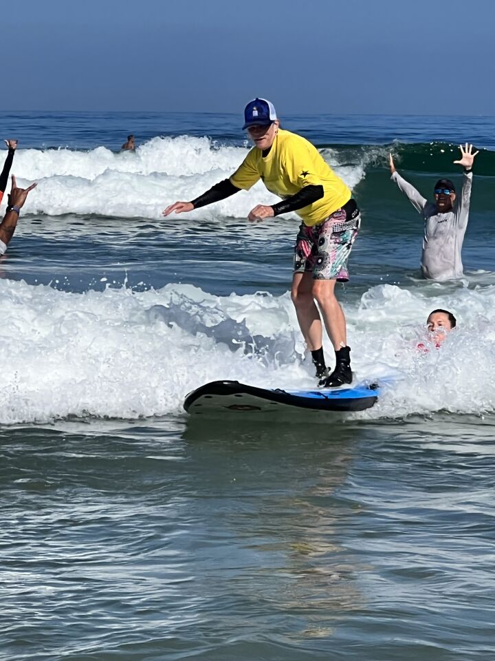 Laura Michelle Grogan says she enjoyed surfing and the camaraderie among her fellow veterans participating in the Summer Sports Clinic.