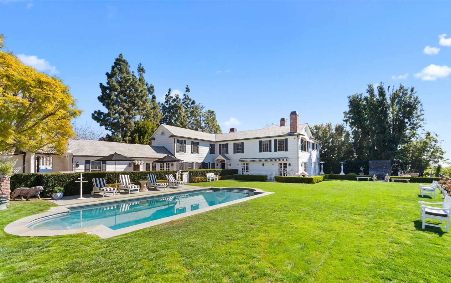 The cul-de-sac compound includes a 1930s home, two-story guesthouse, swimming pool and tiered garden overlooking the Bel Air Country Club golf course.