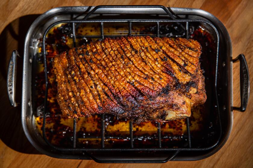 LOS ANGELES, CA - AUGUST 28: Tuscan-style roast pork, cooked in the oven at high heat to brown/caramelize the outside first, for 30-60 minutes, then reduce heat to 250 and cook until internal temp is 200 degrees, 10 to 14 hours, depending on size and weight of the cut, remove from oven, let rest until cool enough to touch with hands for serving, photographed at a Los Angeles, CA, home, Friday, Aug. 28, 2020. (Jay L. Clendenin / Los Angeles Times)
