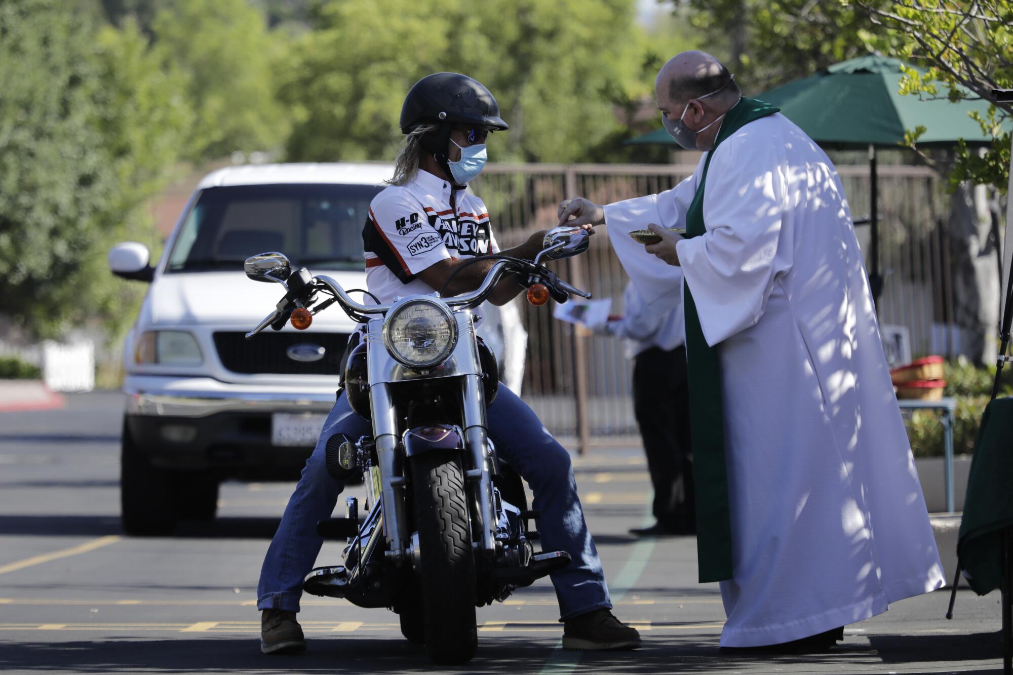 St. Bernardine of Siena Church in Woodland Hills offers drive-through communion prior to outdoor Sunday services.