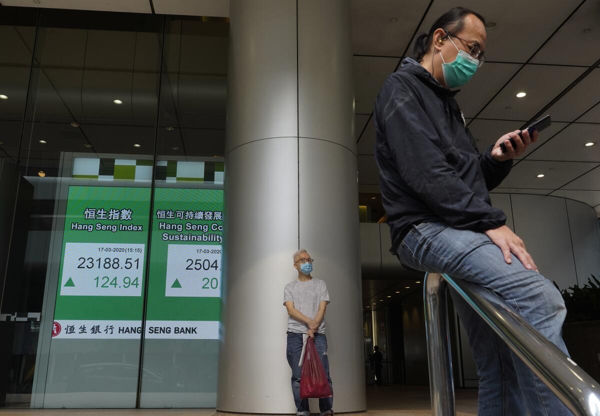 An electronic board at the Hong Kong Stock Exchange on Tuesday.