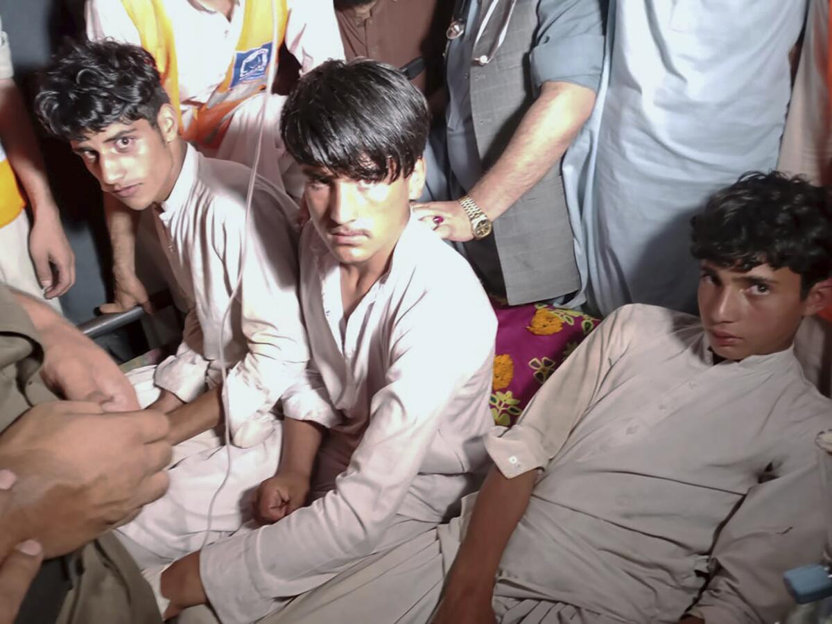 Pakistani youths who were rescued from a broken cable car