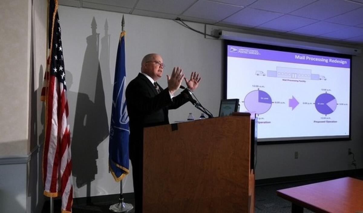 David Williams of the U.S. Postal Service speaks during a news conference at the headquarters of USPS in Washington.