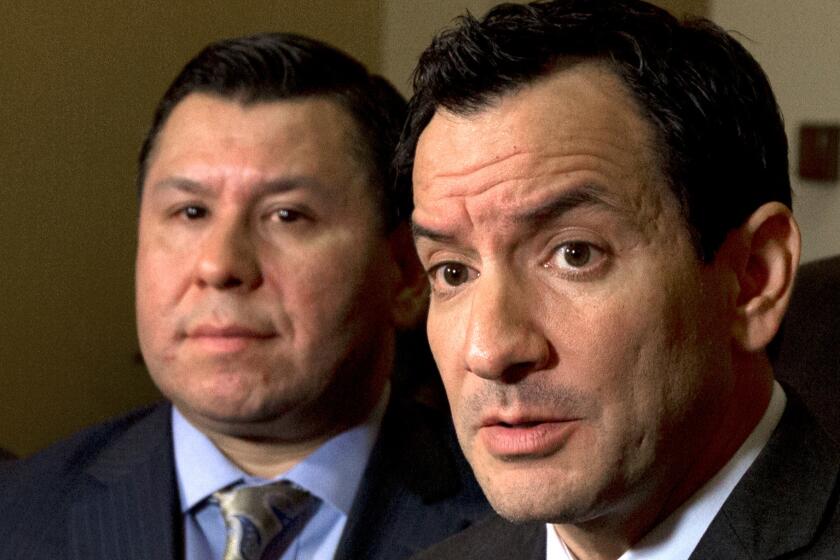 Assembly Speaker Anthony Rendon, right, speaks to reporters about climate legislation that's part of a package from Assemblyman Eduardo Garcia, left, and Sen. Fran Pavley.
