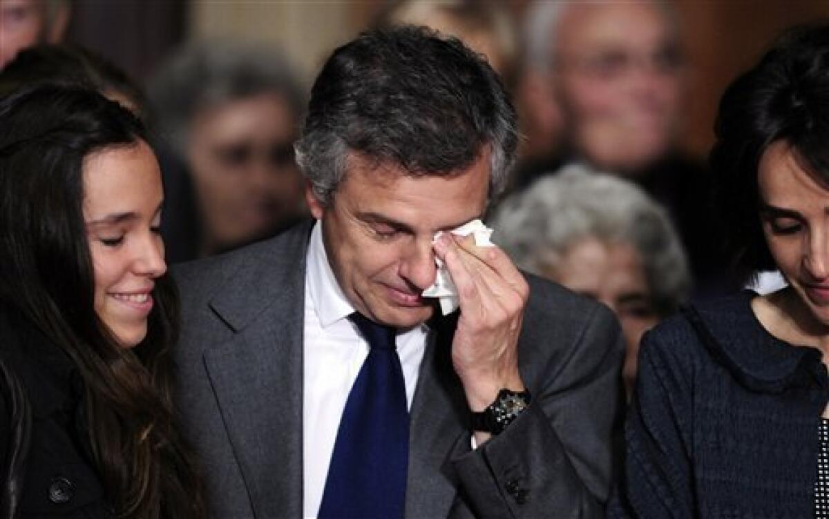 Juan Antonio Samaranch Salisachs, center, son of late former International Olympic Committee president Juan Antonio Samaranch reacts during the farewell ceremony for Juan Antonio Samaranch in the Palau of Generalitat in Barcelona, Spain, on Thursday, April 22, 2010 ahead of Samaranch's funeral later in the day. Former International Olympic Committee president Juan Antonio Samaranch died Wednesday at age 89 in the Quiron Hospital in his home city of Barcelona of cardio-respiratory failure three days after being admitted with heart problems. (AP Photo/Manu Fernandez)