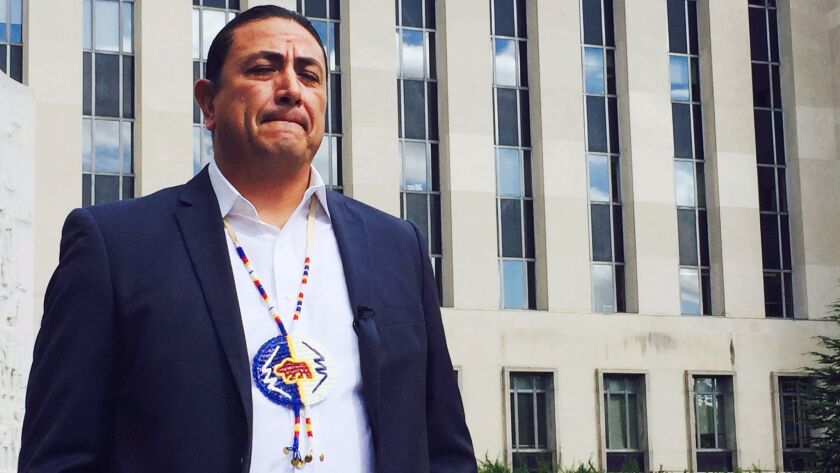 In this Oct. 5, 2016, file photo, Dave Archambault, former chairman of the Standing Rock Sioux Tribe, stands outside a federal appeals court in Washington.
