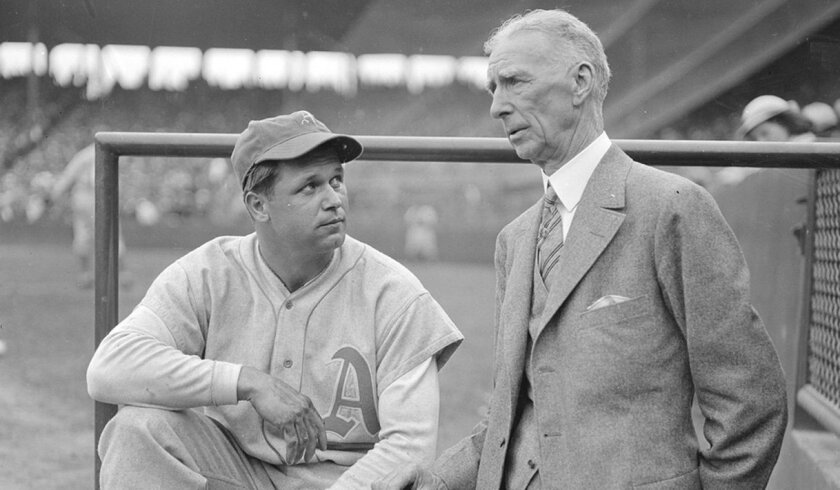 Slugger Jimmie Foxx speaks with Connie Mack, his manager on the Philadelphia Athletics.