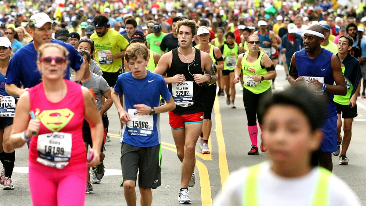Runners pass through downtown Los Angeles during the 2014 L.A. Marathon.