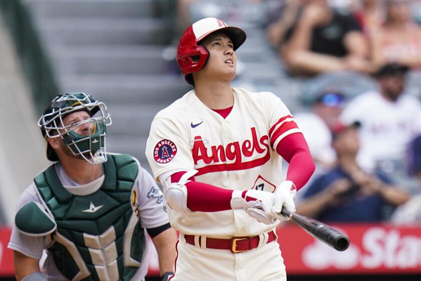 Los Angeles Angels' Shohei Ohtani, of Japan, watches after hitting a home run during the seventh inning.