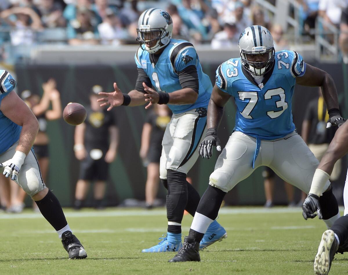 Panthers quarterback Cam Newton takes the snap during the second half of a game against the Jaguars on Sept. 13.