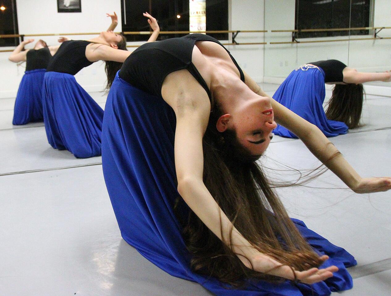 Tenie Avanessian, 18, of Glendale, rehearses a scene from "Priceless Soul, A Tribute to the Life of Albert Djanbazian" at Ajanbazian Dance Foundation in La Crescenta on Tuesday, January 21, 2014. The dance, which was choreographed by Anna Djanbazian for her brother Albert who succumbed to cancer, will be performed at Glendale Community College on Sunday, January 26th. (Tim Berger/Staff Photographer)