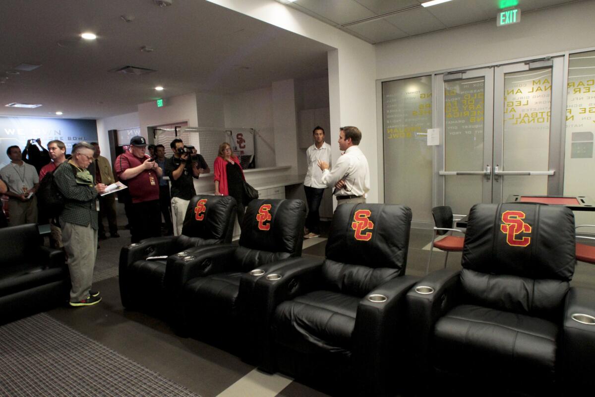 Senior associate athletic director Mark Jackson, right, shows members of the media the players lounge which has a pool table among other amenities at the new John McKay Center on August 21, 2012.