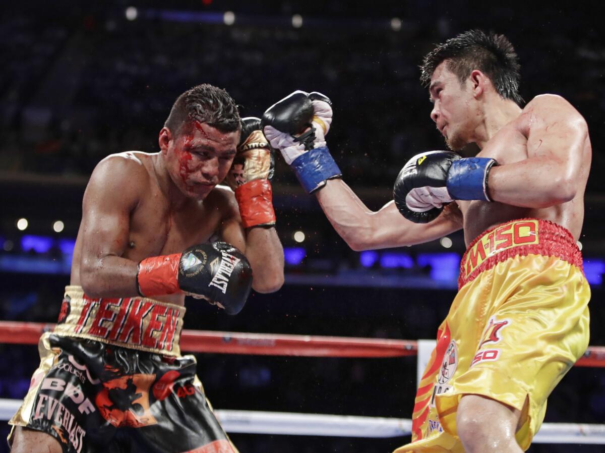 Srisaket Sor Rungvisai, right, punches Roman 'Chocolatito' Gonzalez during their WBC super-flyweight championship fight on March 18 in New York.