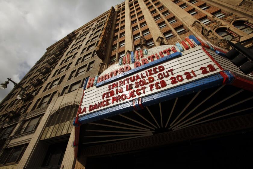 Exterior of the United Artists Theatre in the Ace Hotel and theater building at 937 South Broadway in downtown Los Angeles. The theater built in the Spanish Gothic style and the next door Ace Hotel have been revived. Built in 1927 it was the flagship theater built for the United Artists motion picture studio. It was purchased in 1986 by a church and was well-maintained.