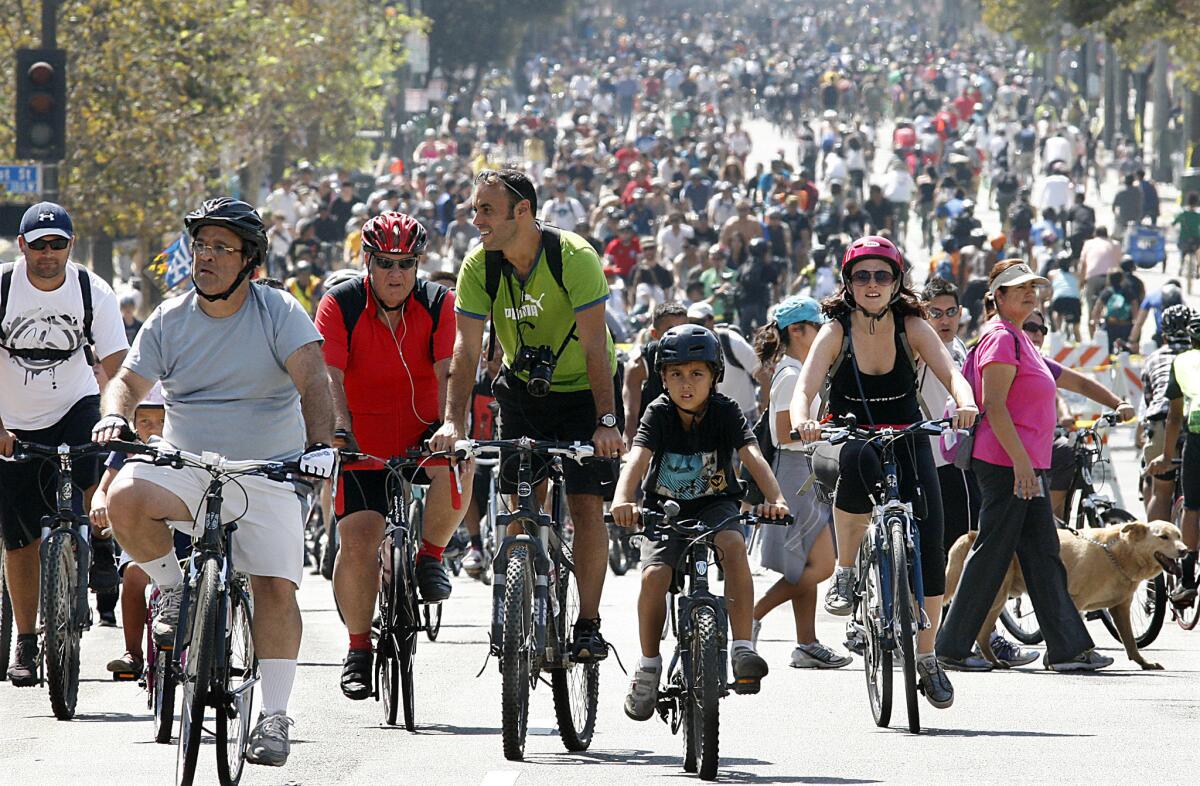 Thousands of bicyclists pedal up and down Spring Street in downtown Los Angeles during the 5th Annual CicLAvia on Oct. 7, 2012.
