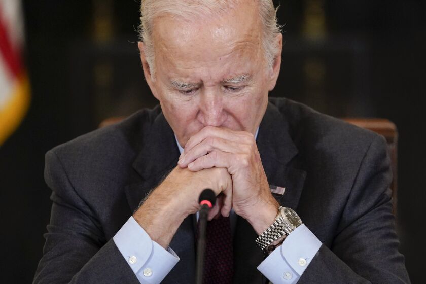 President Joe Biden listens to doctors speak during a meeting of the reproductive rights task force in the State Dining Room of the White House in Washington, Tuesday, Oct. 4, 2022. (AP Photo/Susan Walsh)