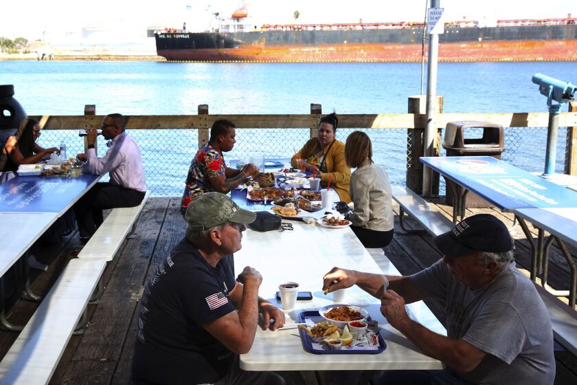 LOS ANGELES, CA-OCTOBER 8, 2019: People eat outside of the San Pedro Fish Market & Restaurant on October 8, 2019 in San Pedro, California. (Photo By Dania Maxwell / Los Angeles Times)