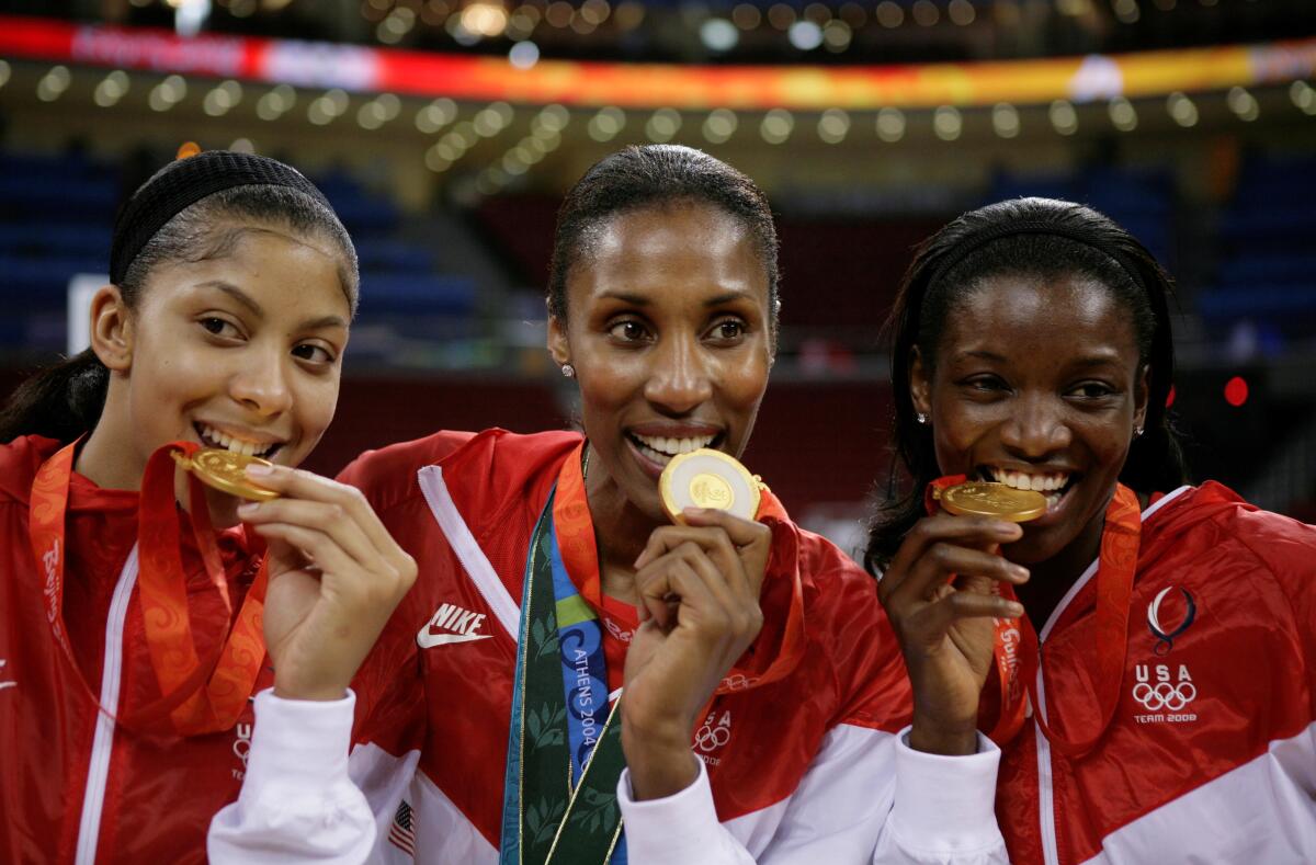 From left, Candace Parker, Lisa Leslie and DeLisha Milton-Jones pose with their gold medals during the 2008 Summer Olympics.