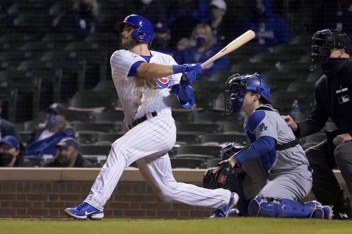 Chicago Cubs' David Bote watches his game winning RBI single off Dodgers relief pitcher Garrett Cleavinger.