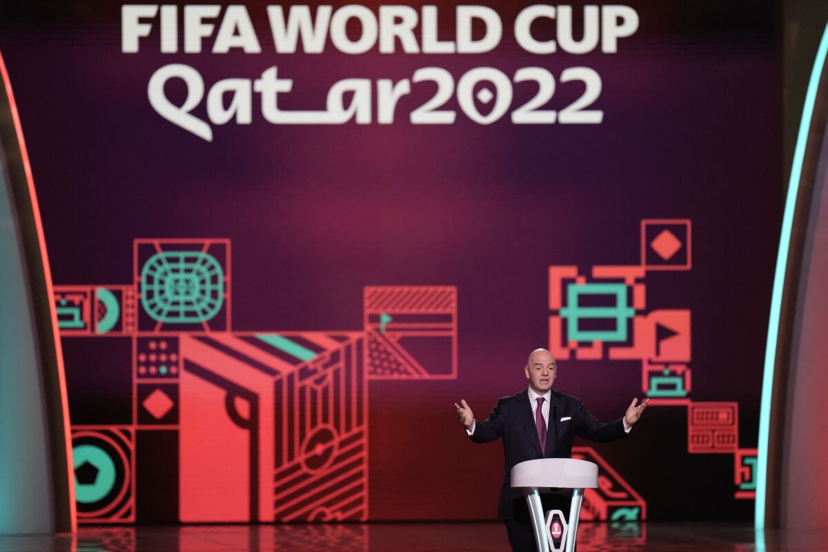 FIFA President Gianni Infantino speaks before the 2022 soccer World Cup draw at the Doha Exhibition and Convention Center in Doha, Qatar, Friday, April 1, 2022. (AP Photo/Hassan Ammar)