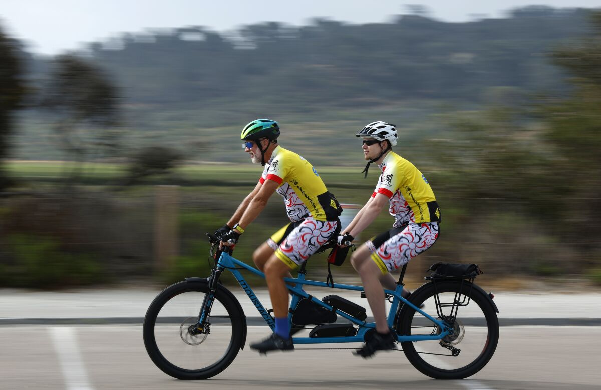 Ron Kelly, left, and Michael Griswold are part of the Blind Stokers tandem cycling club.