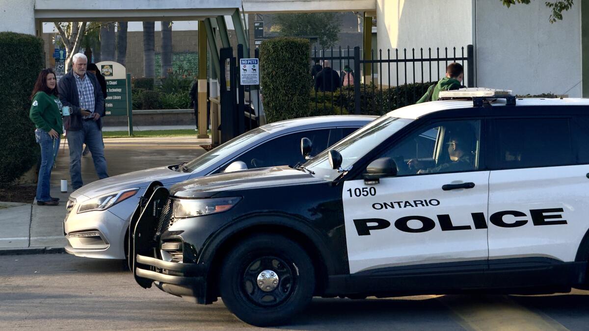 Ontario police cars in front of school.