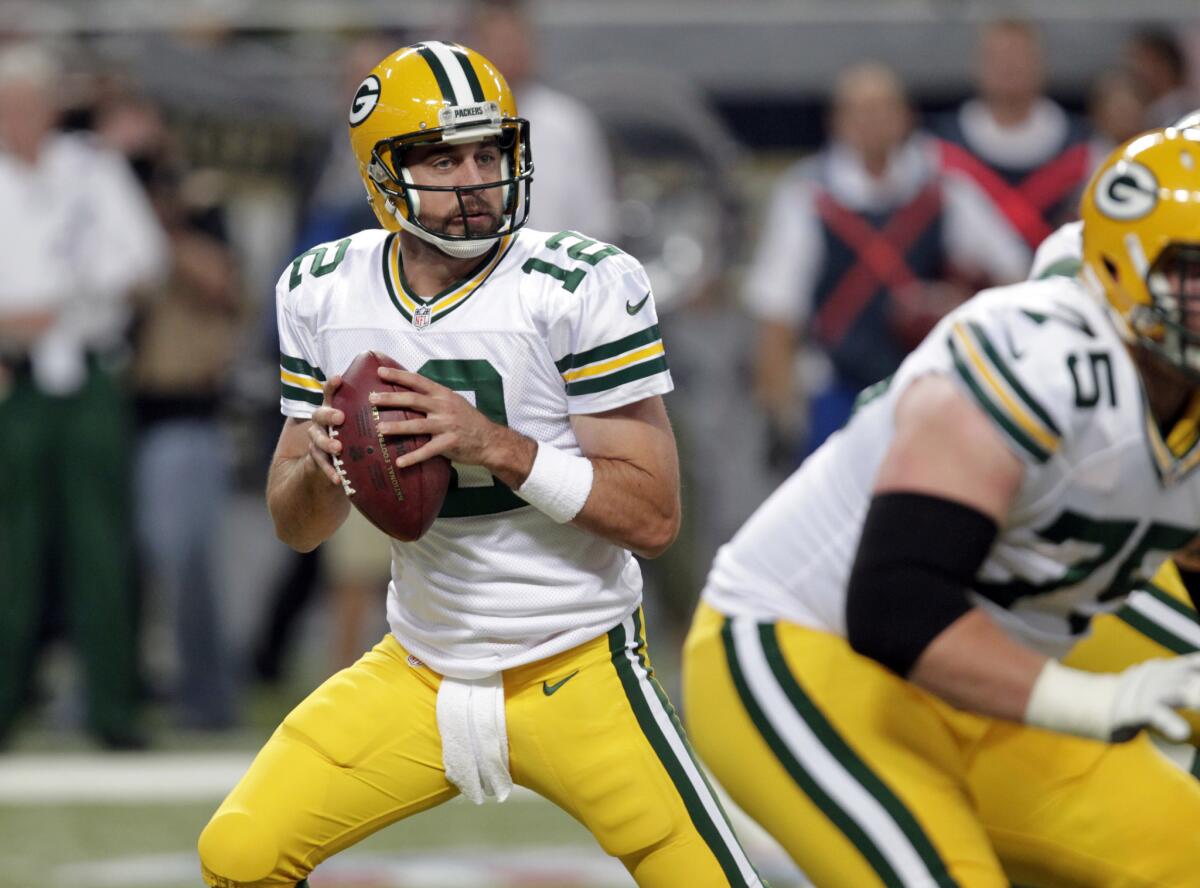 Green Bay quarterback Aaron Rodgers completed 11 of 13 for 128 yards and a touchdown Saturday against St. Louis.