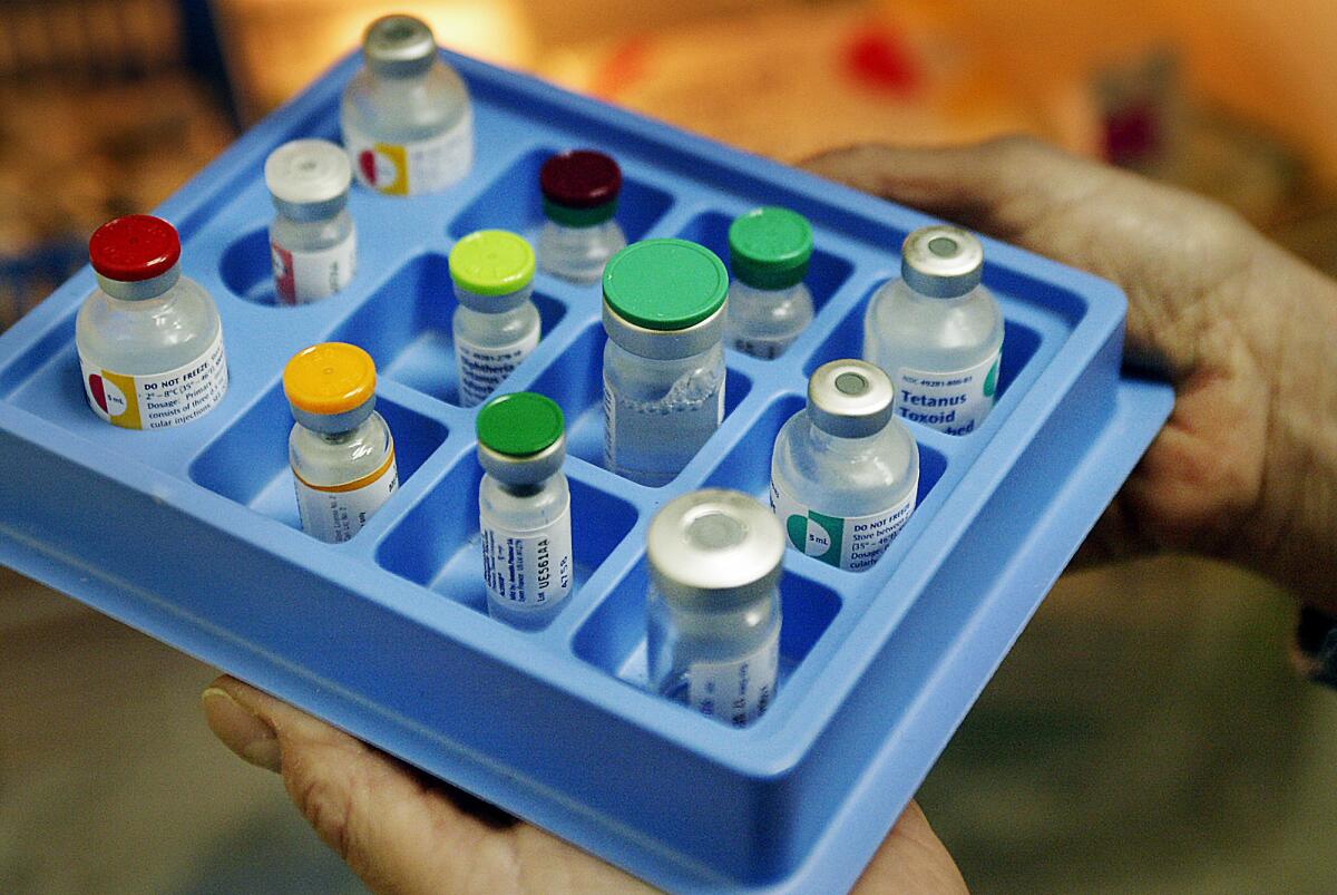 A tray of various childhood vaccinations. Students at Huntington Beach High School who have not been vaccinated for measles are being kept out of school until Jan. 29 after a fellow student tested positive for the contagious virus, the Orange County Health Care Agency said Monday.