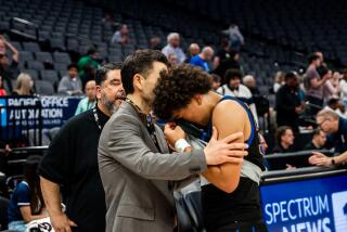 San Juan Hills coach Jason Efstathiou tries to console Kellen Owens after Division IV title game loss.