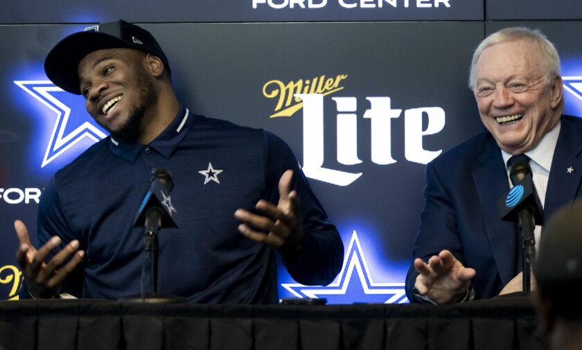 Dallas Cowboys first-round draft pick linebacker Micah Parsons, left, and Dallas Cowboys owner Jerry Jones speak to the media at the Dallas Cowboys headquarters, Friday, April 30, 2021, in Frisco, Texas. (AP Photo/Brandon Wade)