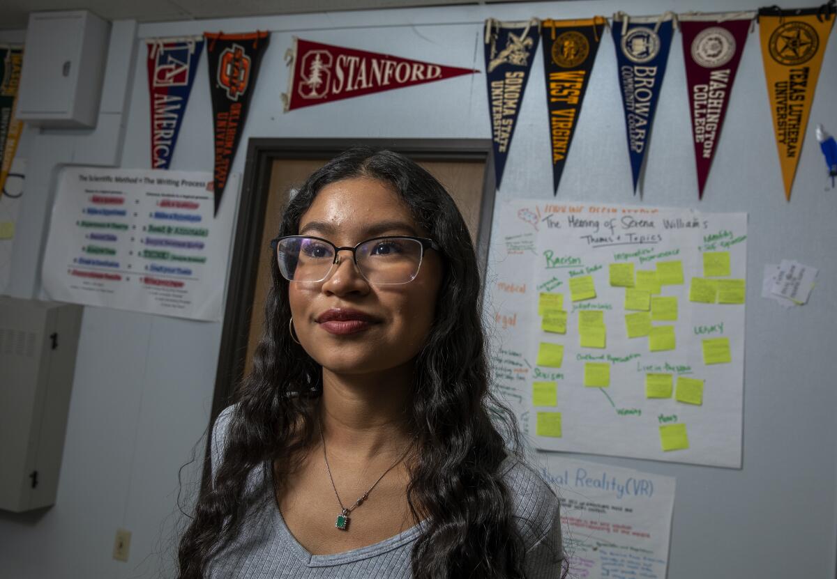 A student poses for a picture, looking off camera. 