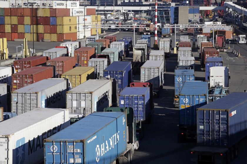 Loaded container trucks at the Port of Seattle on Tuesday, Feb. 17. Activity along the West Coast is expected to pick up following a tentative agreement Friday in a long-running labor dispute.