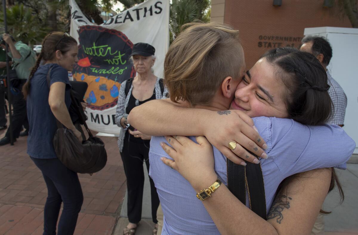 No More Deaths volunteers Zaachila Orozco-McCormick, right, and Geena Jackson embrace after Orozco-McCormick's sentencing last week in Tucson, Ariz.