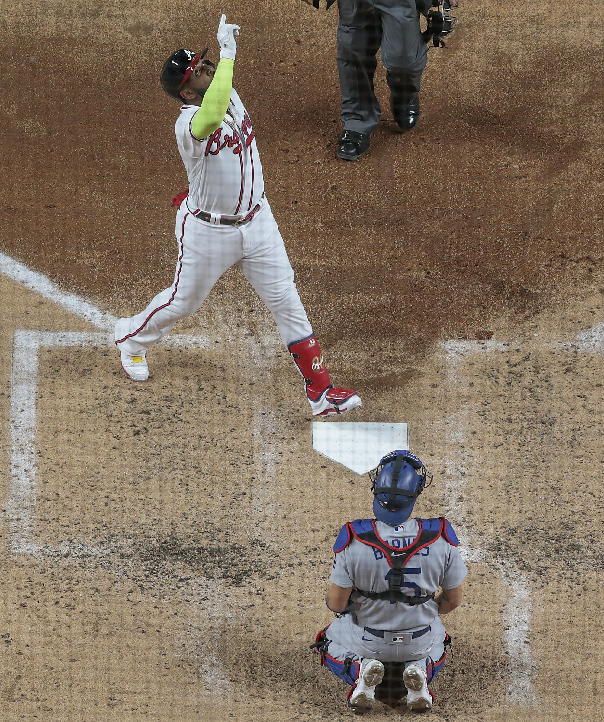 Atlanta Braves designated hitter Marcell Ozuna celebrates after hitting a home run.
